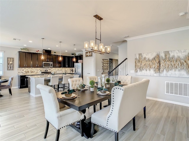260 Teddy Rushing St, Debary, FL 32713 - dining room with visible vents, crown molding, light wood-type flooring, stairway, and recessed lighting
