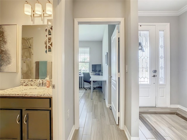 260 Teddy Rushing St, Debary, FL 32713 - entryway featuring crown molding, baseboards, and light wood-type flooring