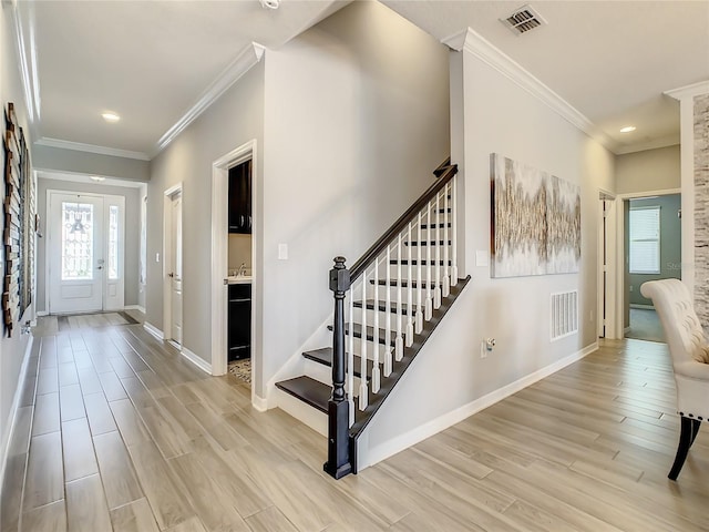 260 Teddy Rushing St, Debary, FL 32713 - foyer with visible vents, baseboards, stairway, and light wood-type flooring