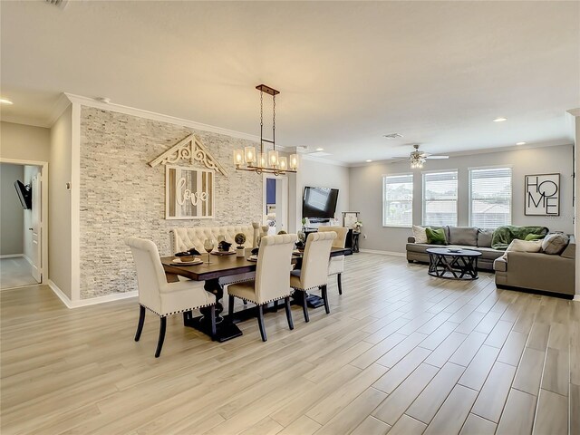 260 Teddy Rushing St, Debary, FL 32713 - dining space with crown molding, light wood-style flooring, ceiling fan with notable chandelier, and baseboards