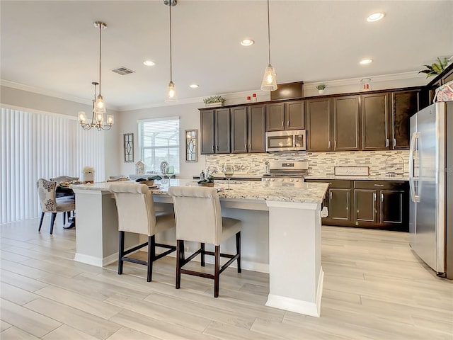260 Teddy Rushing St, Debary, FL 32713 - kitchen featuring visible vents, ornamental molding, dark brown cabinets, appliances with stainless steel finishes, and backsplash