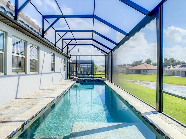 260 Teddy Rushing St, Debary, FL 32713 - view of pool featuring glass enclosure, a patio area, a pool with connected hot tub, and a yard