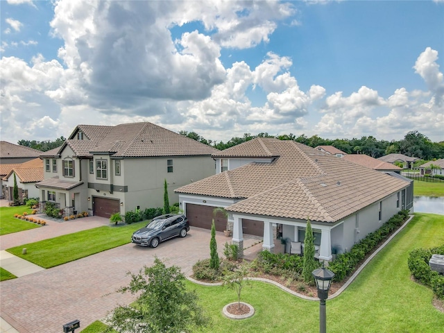 260 Teddy Rushing St, Debary, FL 32713 - view of front of home with decorative driveway, a residential view, stucco siding, and a tile roof