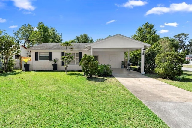 single story home featuring a carport, a front lawn, and driveway