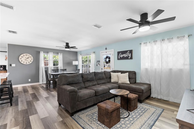 2824 Oak Lea Dr, South Daytona, FL 32119 - living area featuring visible vents, a ceiling fan, and wood finished floors