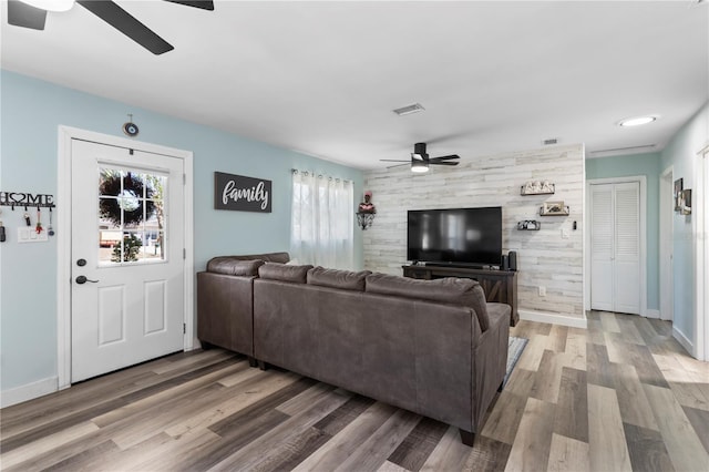 2824 Oak Lea Dr, South Daytona, FL 32119 - living area with a ceiling fan, visible vents, a healthy amount of sunlight, and wood finished floors