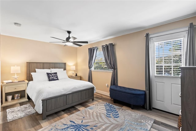 2824 Oak Lea Dr, South Daytona, FL 32119 - bedroom featuring baseboards, a ceiling fan, and wood finished floors