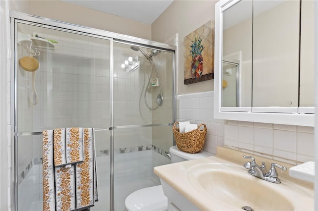 2824 Oak Lea Dr, South Daytona, FL 32119 - bathroom with toilet, tile walls, a shower stall, and vanity