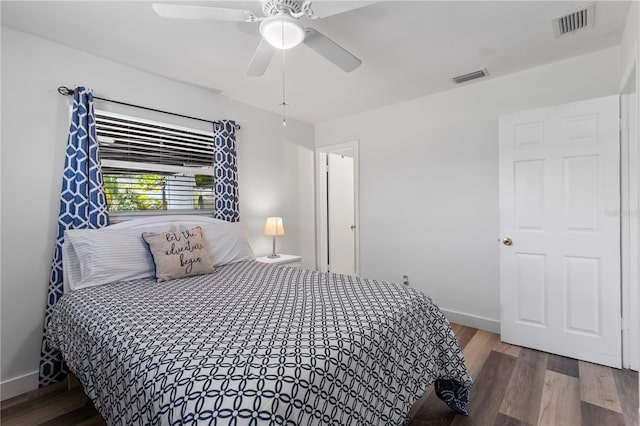 2824 Oak Lea Dr, South Daytona, FL 32119 - bedroom with baseboards, wood finished floors, and visible vents