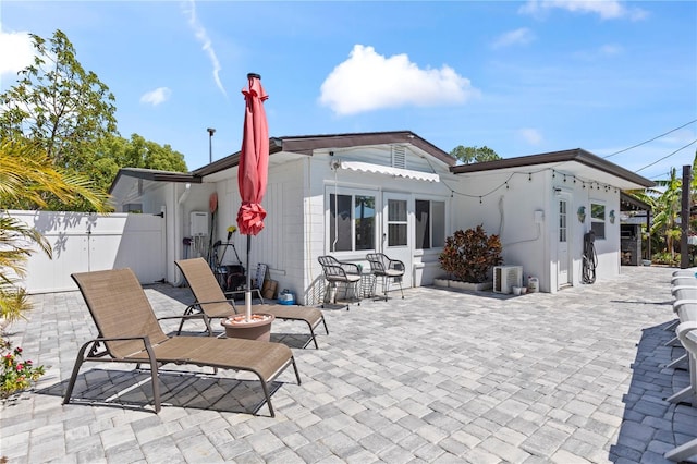 2824 Oak Lea Dr, South Daytona, FL 32119 - back of house featuring a patio and fence