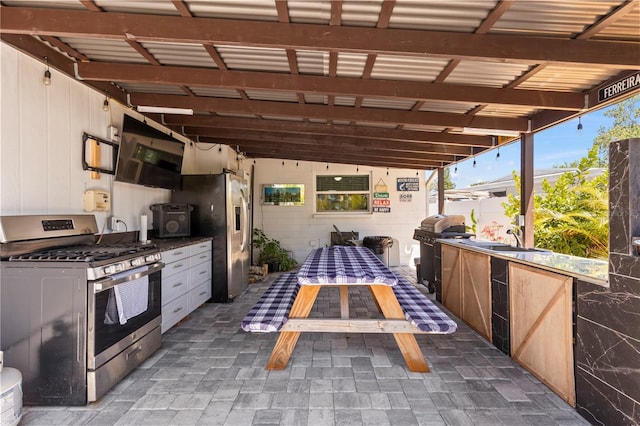 2824 Oak Lea Dr, South Daytona, FL 32119 - view of patio featuring exterior kitchen and outdoor dining space
