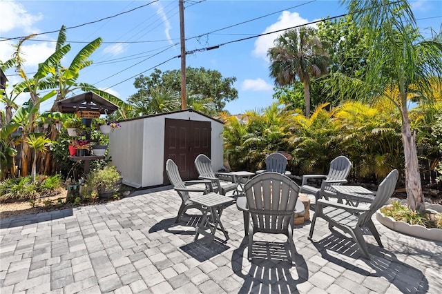 2824 Oak Lea Dr, South Daytona, FL 32119 - view of patio / terrace featuring a storage unit and an outdoor structure