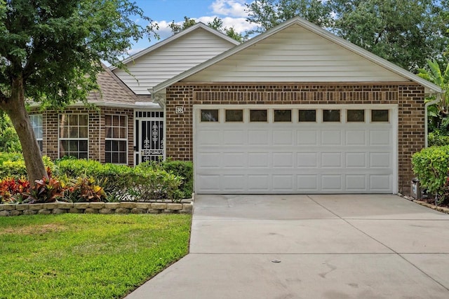 30 Reflections Village Dr, Ormond Beach, FL 32174 - ranch-style house with a shingled roof, an attached garage, a front lawn, brick siding, and concrete driveway