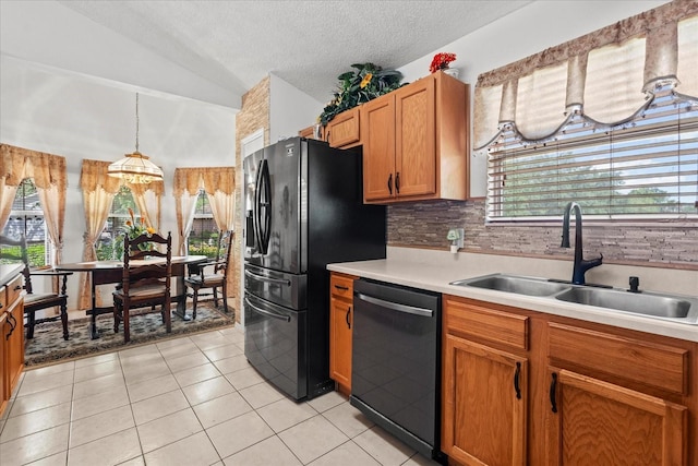 30 Reflections Village Dr, Ormond Beach, FL 32174 - kitchen featuring a sink, dishwasher, light countertops, a textured ceiling, and lofted ceiling
