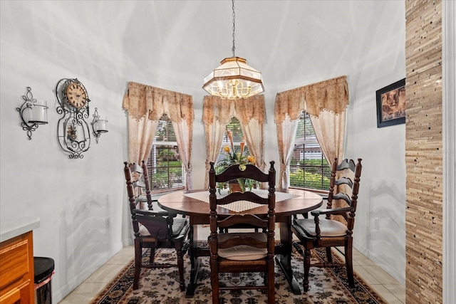 30 Reflections Village Dr, Ormond Beach, FL 32174 - dining room with light tile patterned floors and an inviting chandelier