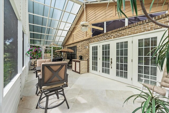 30 Reflections Village Dr, Ormond Beach, FL 32174 - sunroom / solarium with ceiling fan, french doors, and an outdoor living space with a fire pit