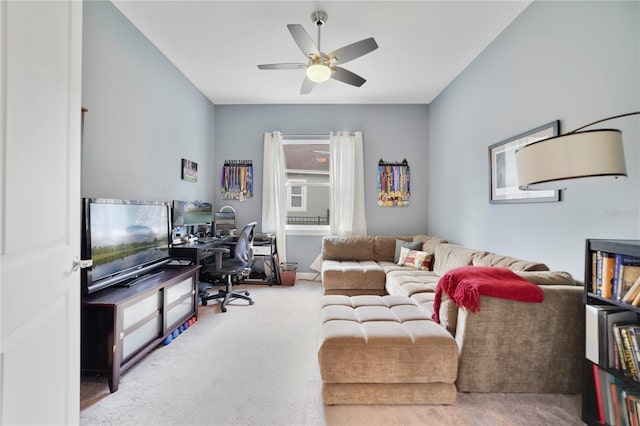 living area with carpet floors and ceiling fan