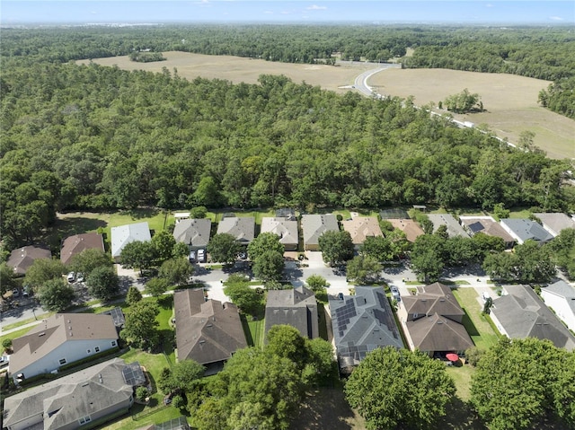 bird's eye view with a residential view and a wooded view
