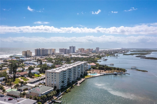 birds eye view of property with a city view and a water view