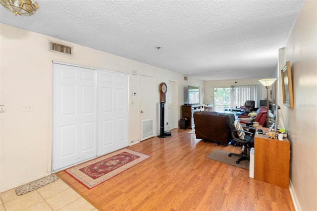 313 Dirksen Dr Unit A5, Debary, FL 32713 - office with a textured ceiling, light wood finished floors, and baseboards