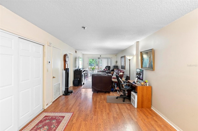 313 Dirksen Dr Unit A5, Debary, FL 32713 - office featuring a textured ceiling and light wood finished floors