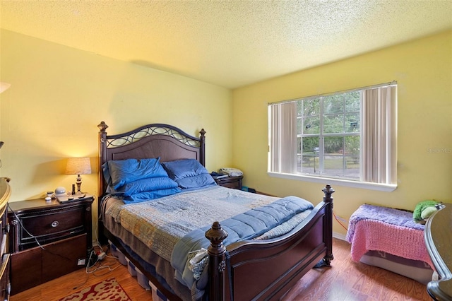 313 Dirksen Dr Unit A5, Debary, FL 32713 - bedroom with wood finished floors and a textured ceiling