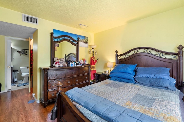 313 Dirksen Dr Unit A5, Debary, FL 32713 - bedroom featuring wood finished floors and a textured ceiling