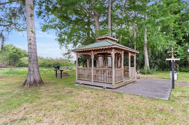 313 Dirksen Dr Unit A5, Debary, FL 32713 - view of property's community with a gazebo, a lawn, and a patio
