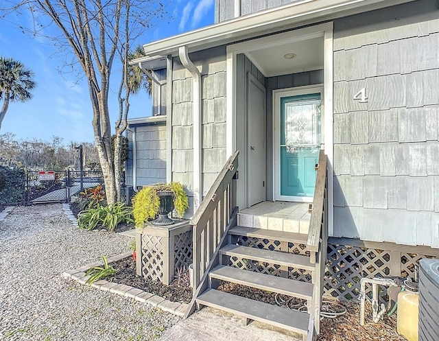 property entrance with a gate and fence