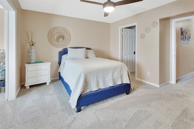bedroom with baseboards, a ceiling fan, visible vents, and carpet