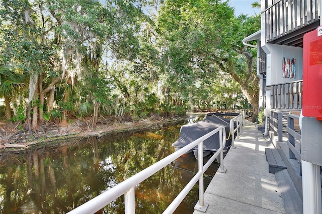 dock area with a water view