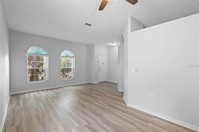 15733 Green Point Ct, Clermont, FL 34714 - empty room featuring light wood finished floors, visible vents, baseboards, and a ceiling fan