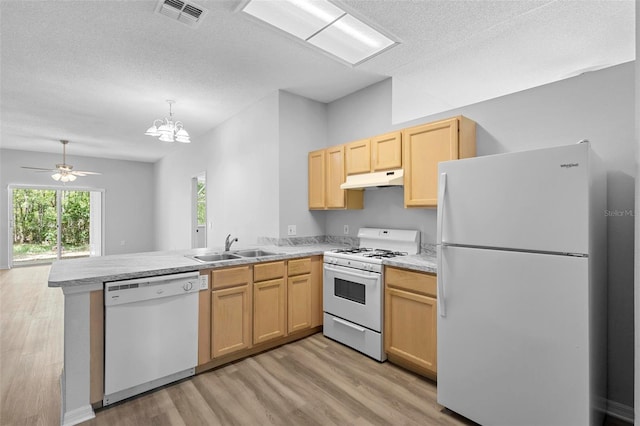 15733 Green Point Ct, Clermont, FL 34714 - kitchen featuring white appliances, light brown cabinets, a peninsula, and visible vents