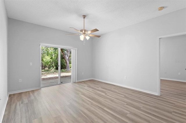 15733 Green Point Ct, Clermont, FL 34714 - spare room with light wood finished floors, a textured ceiling, baseboards, and ceiling fan