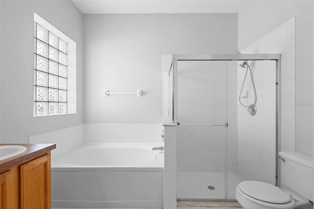 15733 Green Point Ct, Clermont, FL 34714 - full bathroom featuring toilet, vanity, a bath, and a shower stall
