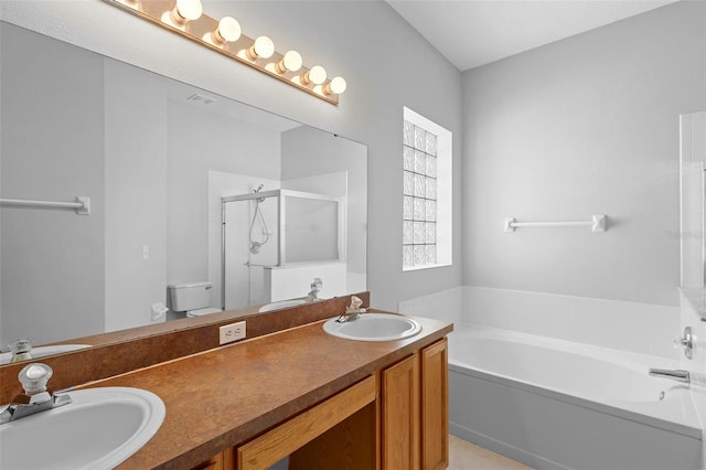 15733 Green Point Ct, Clermont, FL 34714 - bathroom featuring a sink, double vanity, a garden tub, and a shower stall