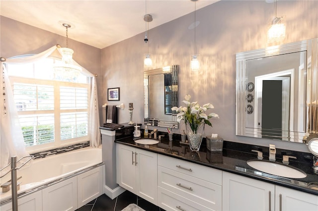 bathroom featuring double vanity, a sink, a bath, and tile patterned flooring