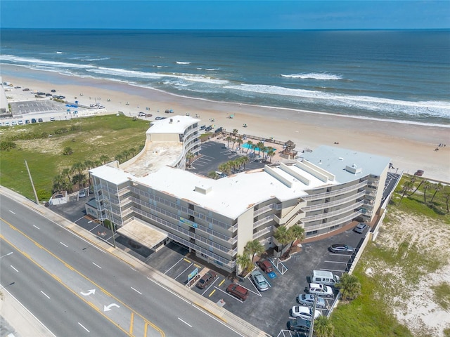 bird's eye view featuring a beach view and a water view