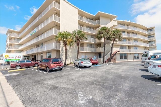 view of property with uncovered parking