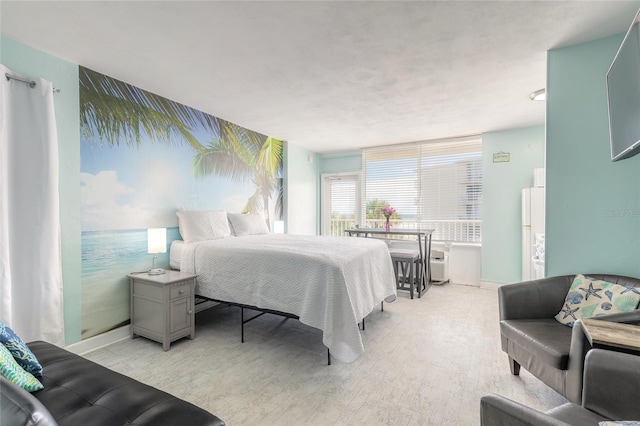 bedroom with light wood-type flooring and baseboards