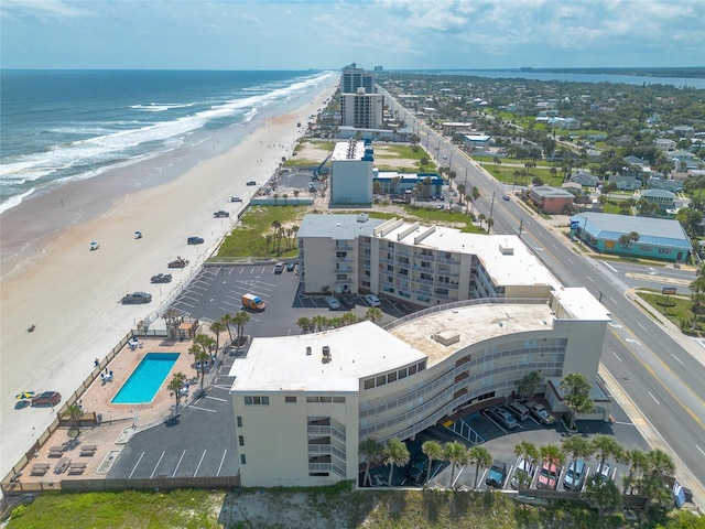 bird's eye view with a beach view and a water view