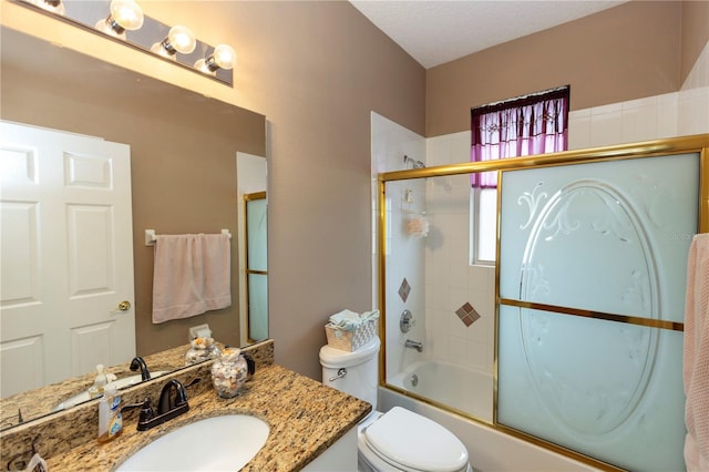 full bathroom with vanity, combined bath / shower with glass door, and toilet