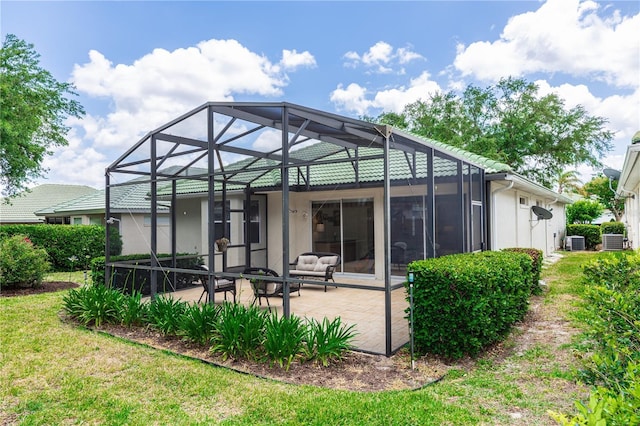 rear view of house featuring an outdoor living space, a patio, stucco siding, and cooling unit