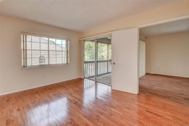 313 Dirksen Dr Unit B15, Debary, FL 32713 - unfurnished room featuring wood finished floors, a textured ceiling, and baseboards