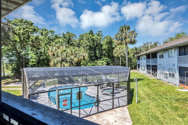 313 Dirksen Dr Unit B15, Debary, FL 32713 - community pool featuring a lawn, glass enclosure, a patio, and view of wooded area