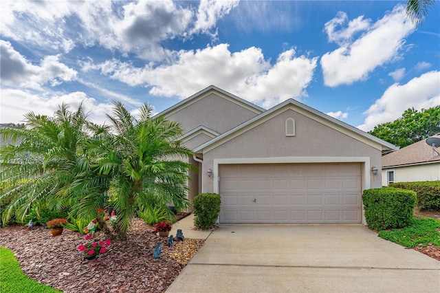 276 Gala Cir, Daytona Beach, FL 32124 - view of front facade featuring stucco siding, concrete driveway, and an attached garage