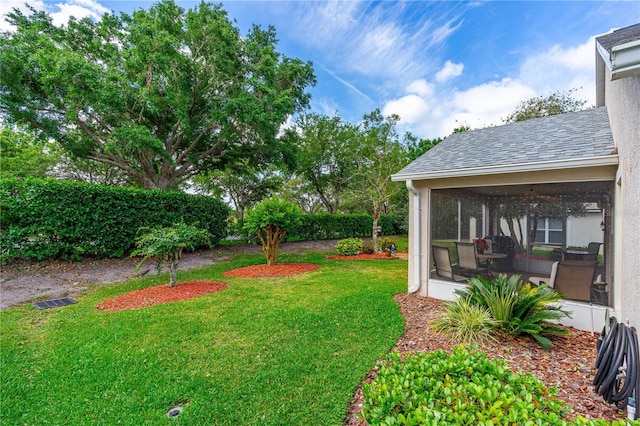 276 Gala Cir, Daytona Beach, FL 32124 - view of green lawn featuring a sunroom and a ceiling fan