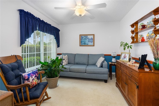 276 Gala Cir, Daytona Beach, FL 32124 - living room featuring light colored carpet, ceiling fan, and a textured ceiling