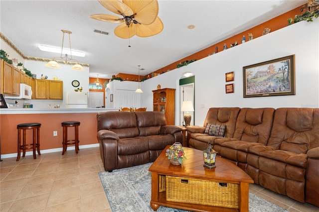 276 Gala Cir, Daytona Beach, FL 32124 - living room featuring ceiling fan, light tile patterned floors, arched walkways, and baseboards