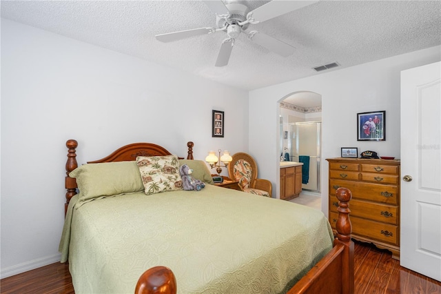 276 Gala Cir, Daytona Beach, FL 32124 - bedroom with arched walkways, wood finished floors, a textured ceiling, ceiling fan, and baseboards